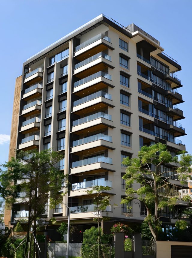 A residential society in Maharashtra surrounded by coconut trees.